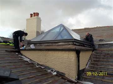 Mr V. West Kirby Wirral : Removal of Slate Roof to form Glass Atrium - Roof System HWL - Ral 7011 - Marine Finish Polyester Powder Coated Aluminium. Thermally broken ; Glazed with triple glazed panels - center pane Uvalue .78